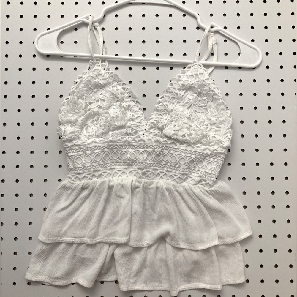 Lace tank top 
Adjustable straps, starchy back